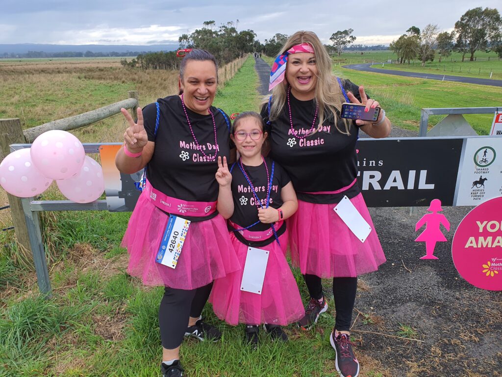 Excited locals dressed in pink get ready to participate in the Mother's Day Classic along the Gippsland Plains Rail Trail