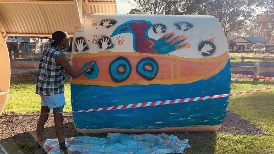 Gunnai artist Ronald Edwards Pepper creates artwork along the Gippsland Plains Rail Trail